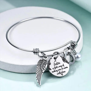 A "Sister is God's Way Of Making Sure We Never Walk Alone" Bangle