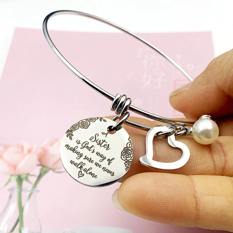 A "Sister is God's Way Of Making Sure We Never Walk Alone" Bangle