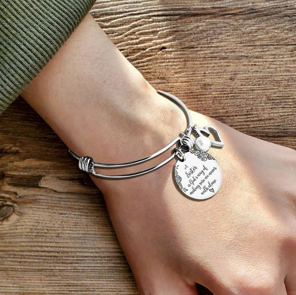 A "Sister is God's Way Of Making Sure We Never Walk Alone" Bangle