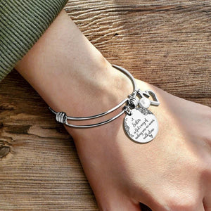 A "Sister is God's Way Of Making Sure We Never Walk Alone" Bangle