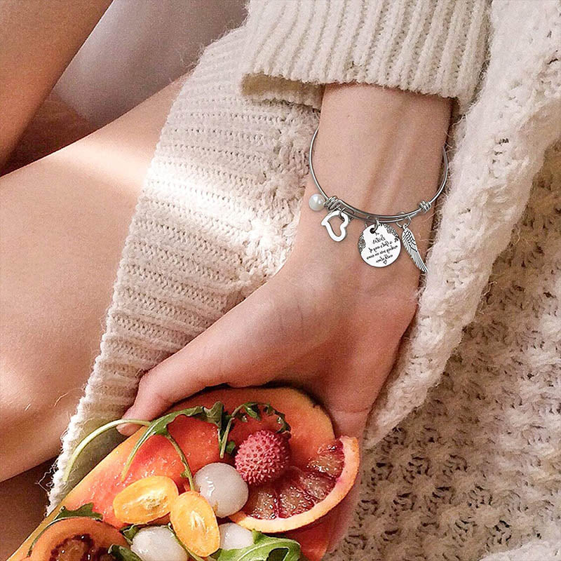 A "Sister is God's Way Of Making Sure We Never Walk Alone" Bangle