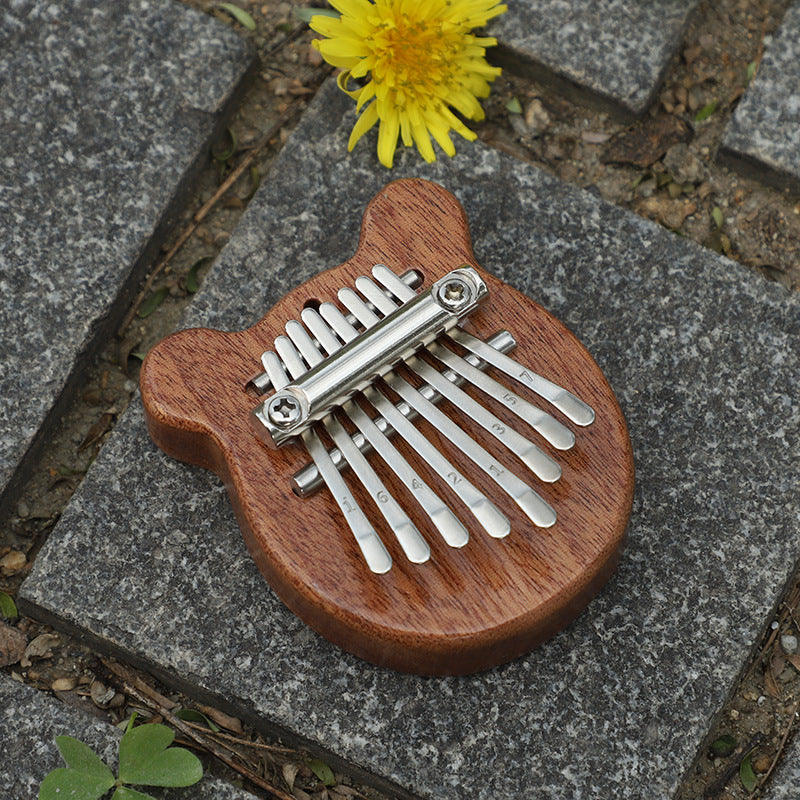 Portable thumb piano