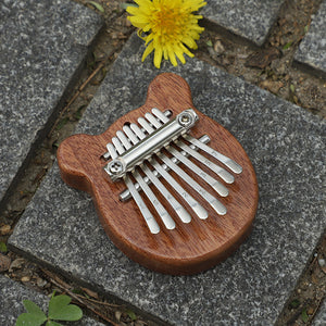 Portable thumb piano